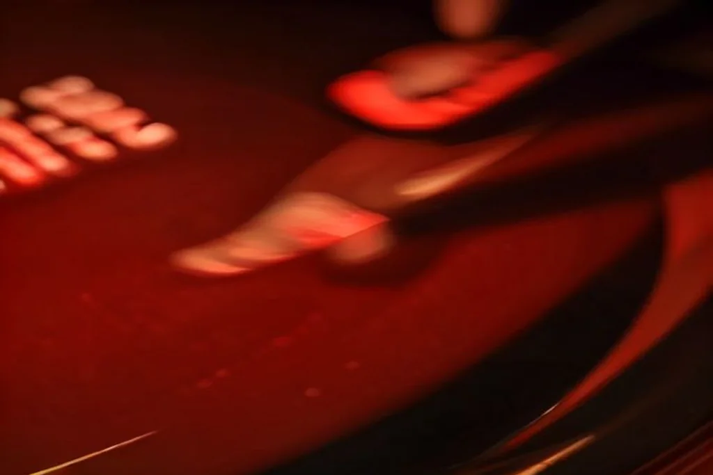 Live casino roulette wheel with dealer hands and chips