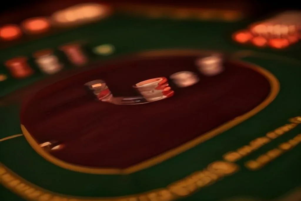 Close-up of roulette betting layout with stacked chips